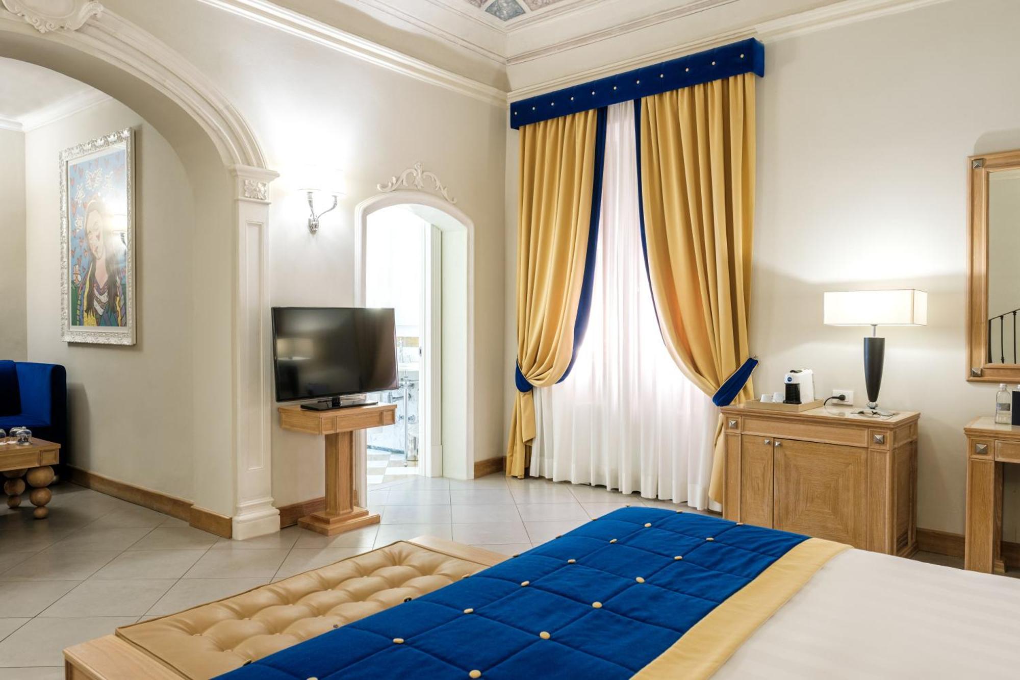 פירנצה Villa Tolomei Hotel & Resort מראה חיצוני תמונה A bedroom at the hotel