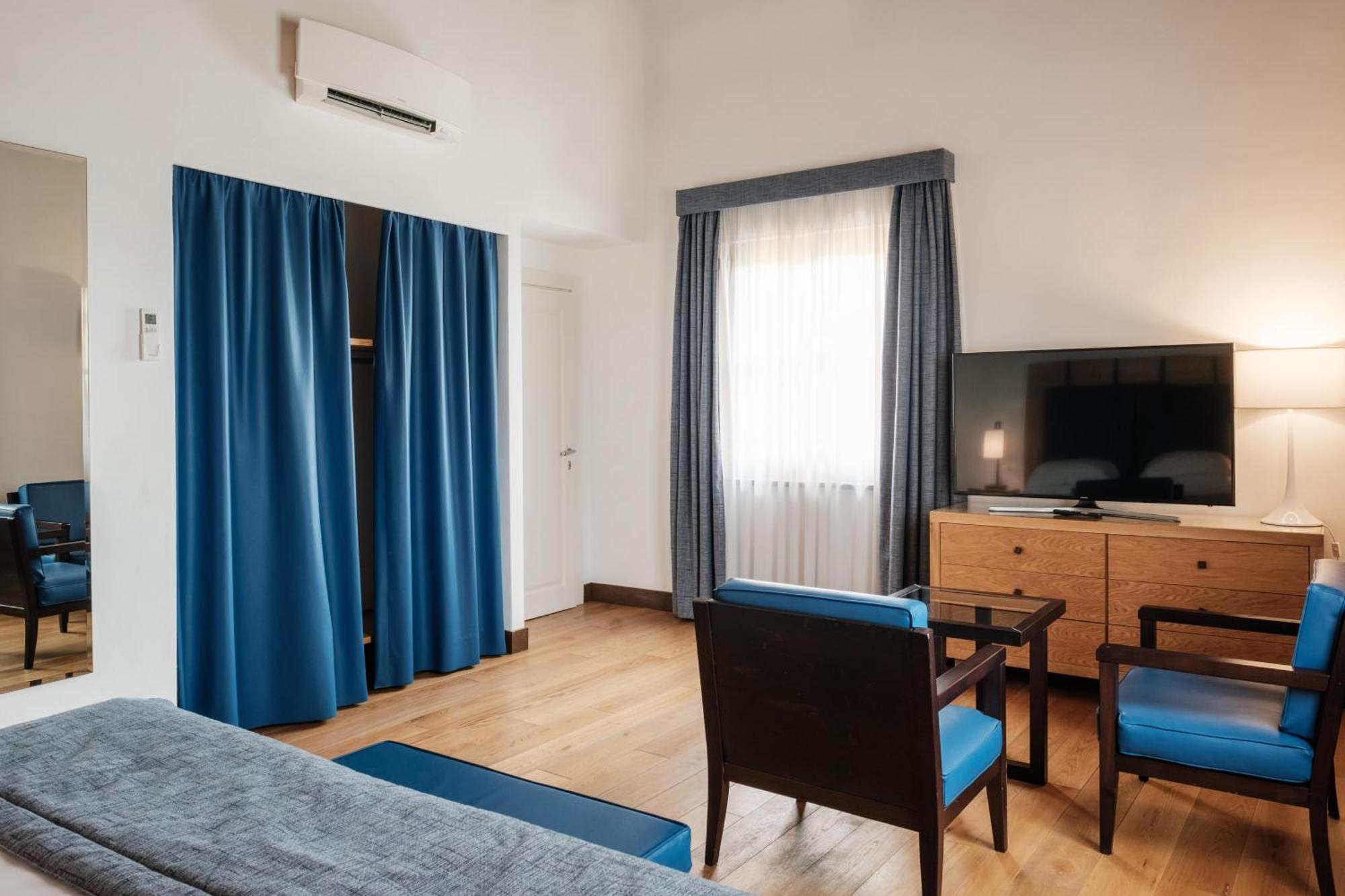 פירנצה Villa Tolomei Hotel & Resort מראה חיצוני תמונה A room at the hotel