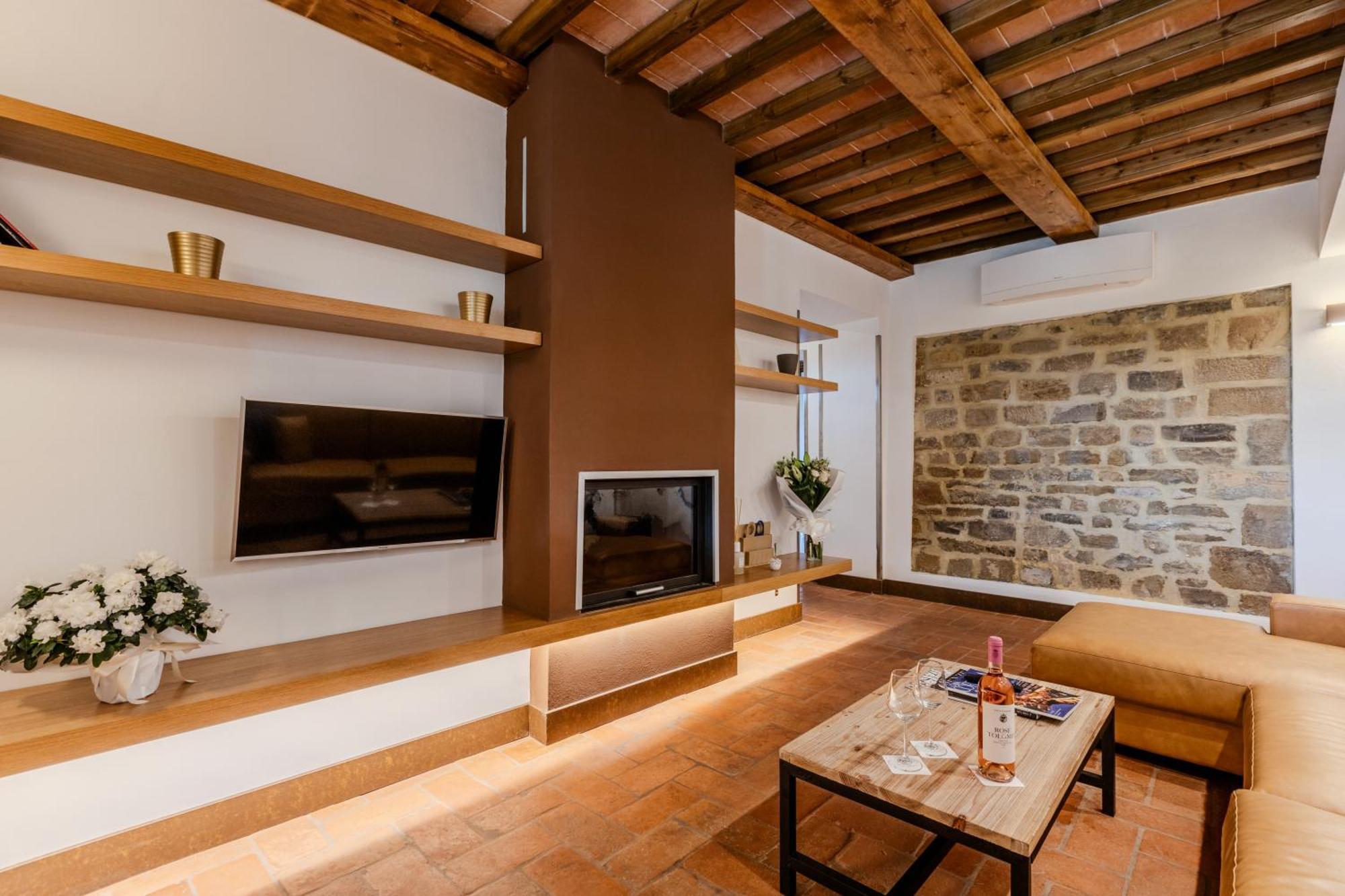 פירנצה Villa Tolomei Hotel & Resort מראה חיצוני תמונה A living room in a hotel